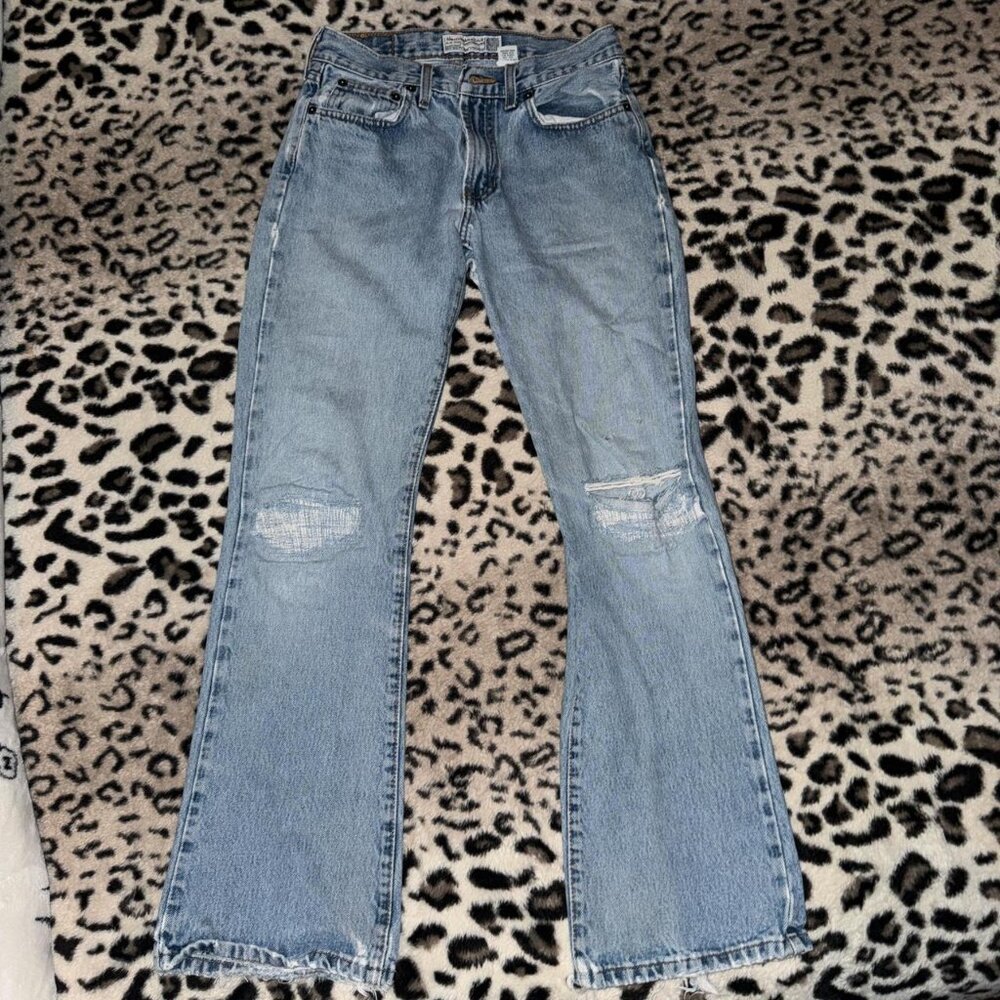 light wash distressed low waisted straight jeans
